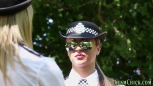 Clothed European police women tug