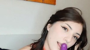 Spider girl masturbating with her purple vibrator